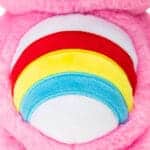 Close up of Care Bears Cheer Bear's belly, emphasizing the rainbow emblem.