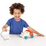 Boy pulling Fisher-Price Chatter Phone.