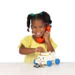 Girl holding Fisher-Price Chatter Phone to her ear.