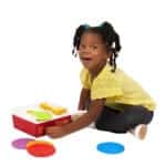 Young girl playing with Fisher-Price Record Player.
