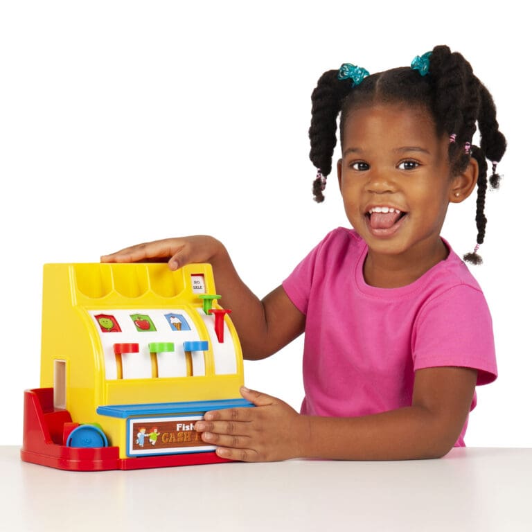 Fisher-Price Classics Cash Register | girl smiling next to toy