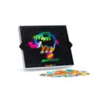 Classic Lite Brite with colorful pegs on white background.