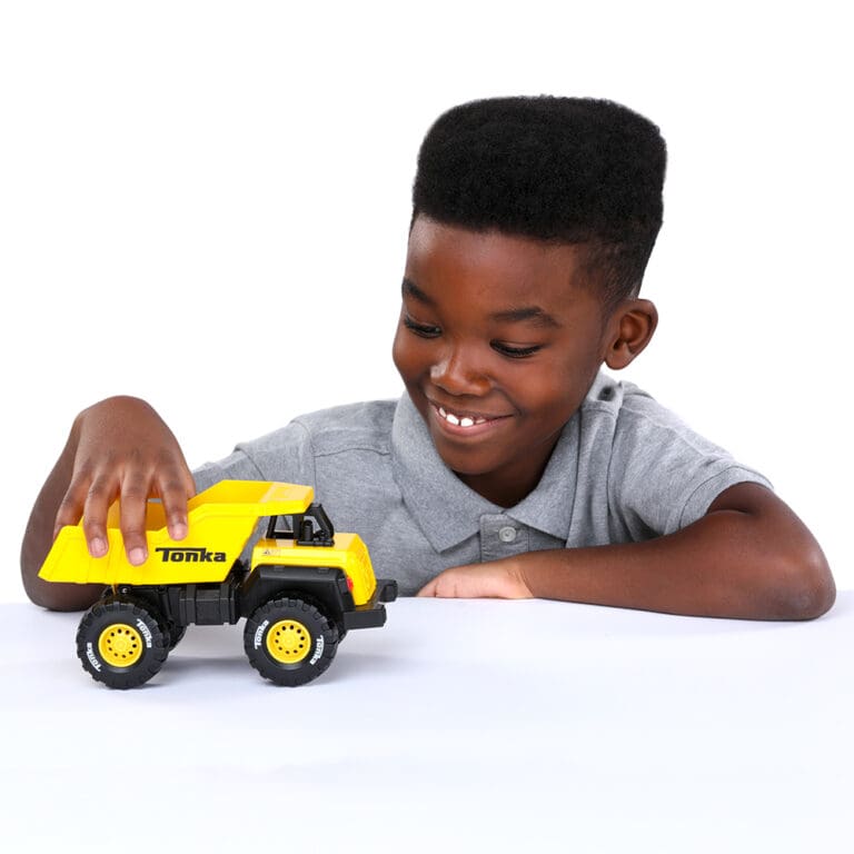 Boy playing with Tonka Dump Truck