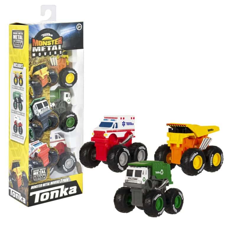 3 Monster Metal Movers next to their box on white background