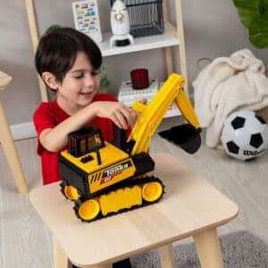 Boy playing with Tonka Excavator