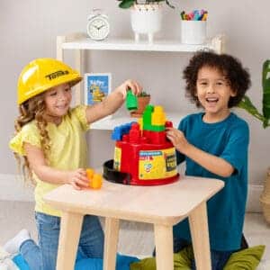 Two kids playing with the Tonka Tough Builders Hard Hat and Bucket playset, best imaginative play toys.