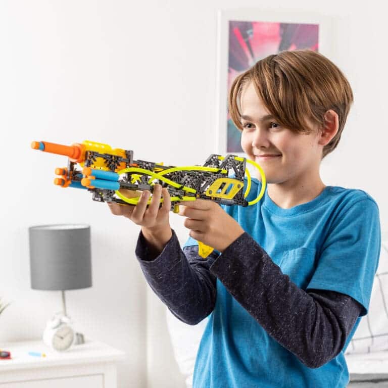 Boy playing with K'NEX Cyber-X Neostrike