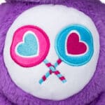 Share Bear stomach close up with pink and blue lollipop patches.
