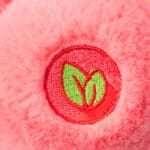 Close up of Love-A-Lot Bear's foot, emphasizing the emblem.