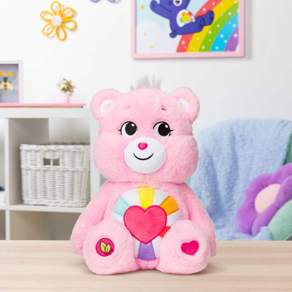 Pink Hopeful Heart Bear sitting on desk