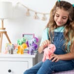 Young girl with My Little Pony Collection in bedroom.