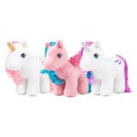 Group shot of plush unicorn and pegasus ponies against white background.