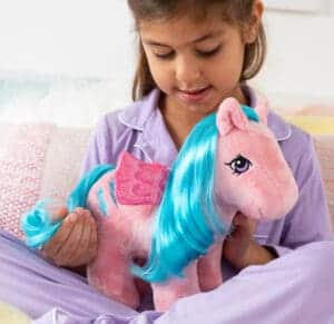 Girl with pink Pegasus plush with purple hair