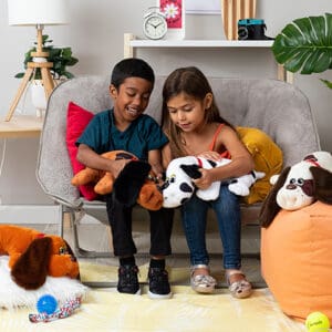 Boy and girl playing with Pound Puppies