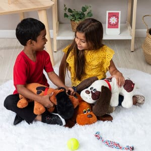 Boy and girl playing with Pound Puppies