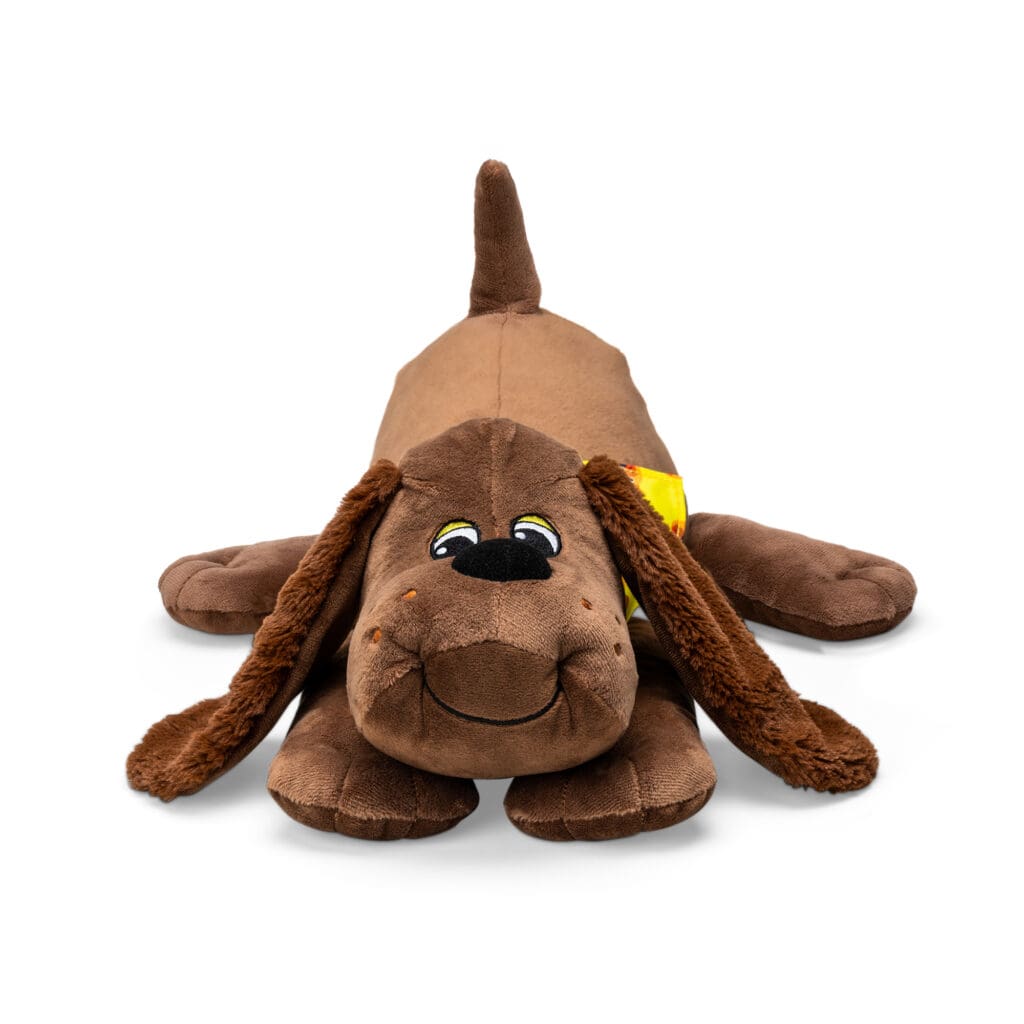 Classic Pound Puppies Plush Zany laying down against white background.