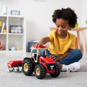 kid with tractor and plow