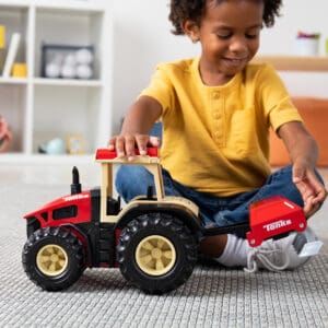 kid with tractor and plow