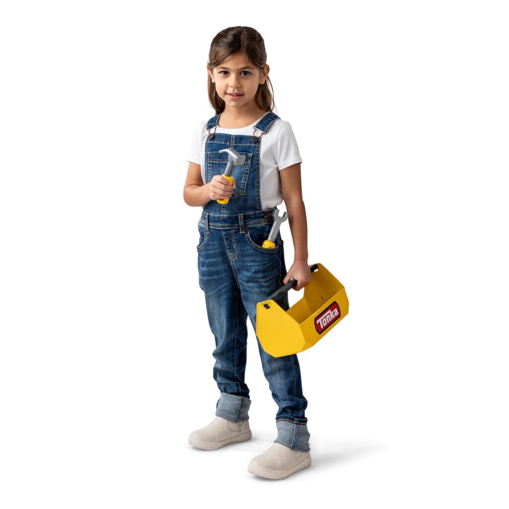 Young girl holding Tonka Tough Toolbox Set.