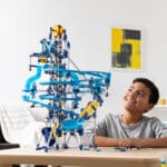 Young boy playing with K'nex Marble Coaster Run with Motor.