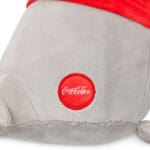 Close up of Trendy Seal's Coca-Cola logo.