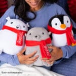 Young girl holding Coca-Cola Trendy Seals.