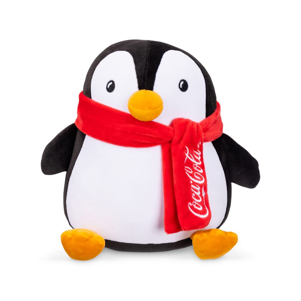 Coca-Cola Trendy Penguin with red scarf against white background.