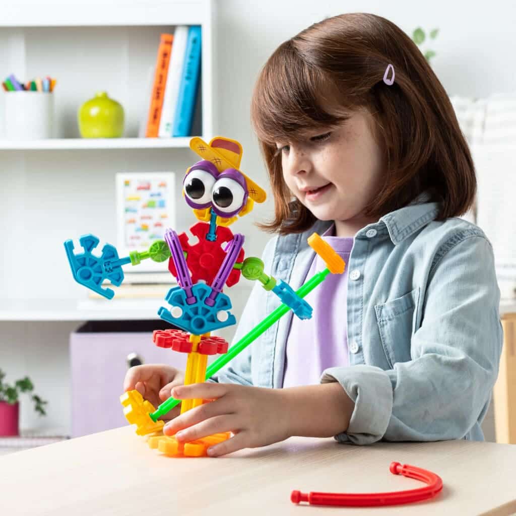 Young girl with K'nex Farmin' Friends Building Set.