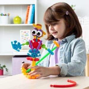 Young girl with K'nex Farmin' Friends Building Set.
