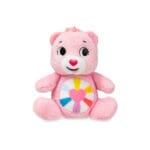 Pink Care Bears Hopeful Heart Bear against white background.
