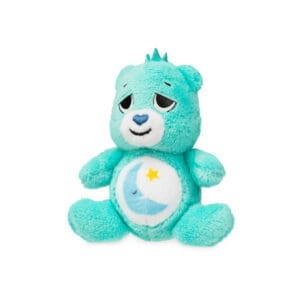 Care Bears Micro Harmony Bear with colorful sun stomach emblem against white background.