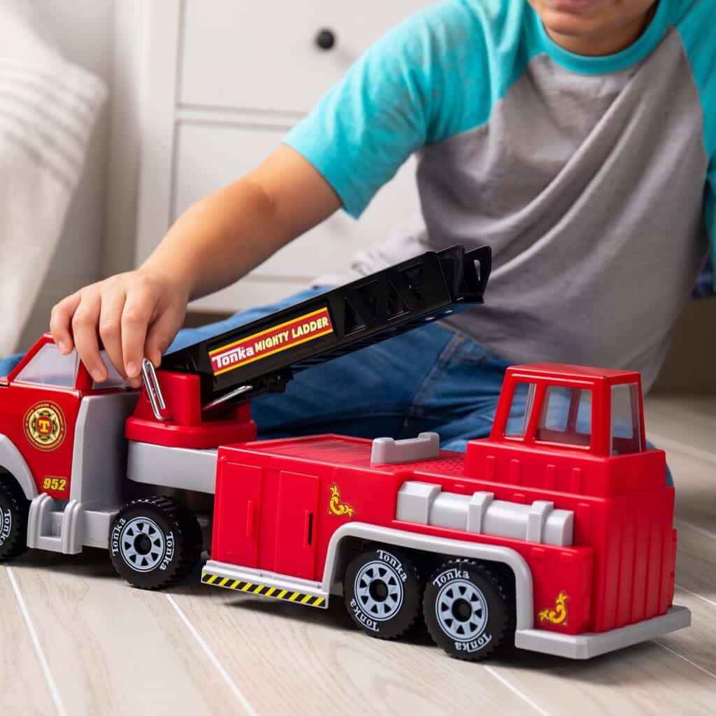 Tonka Hook N' Ladder Fire Truck being played with by young boy.