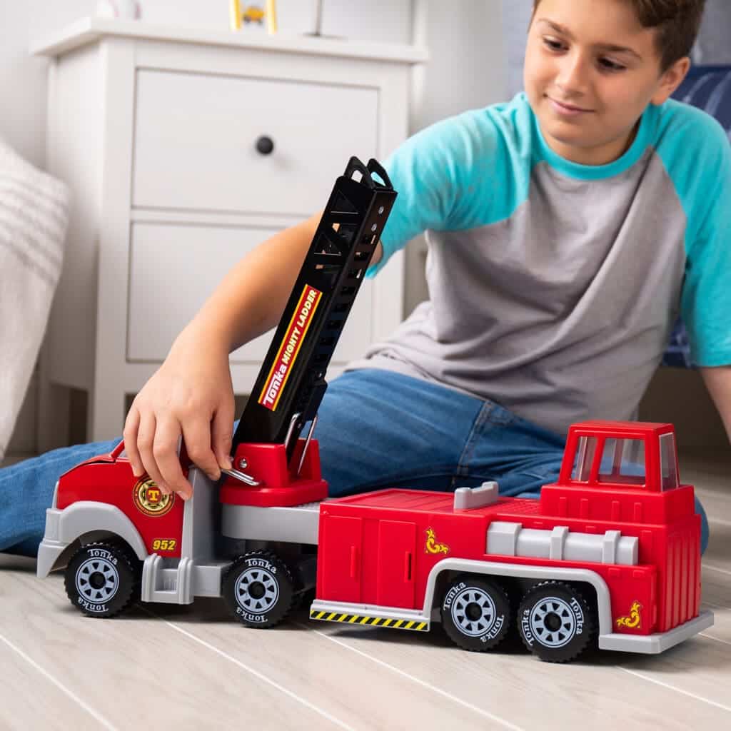 Tonka Hook N' Ladder Fire Truck being played with by young boy.
