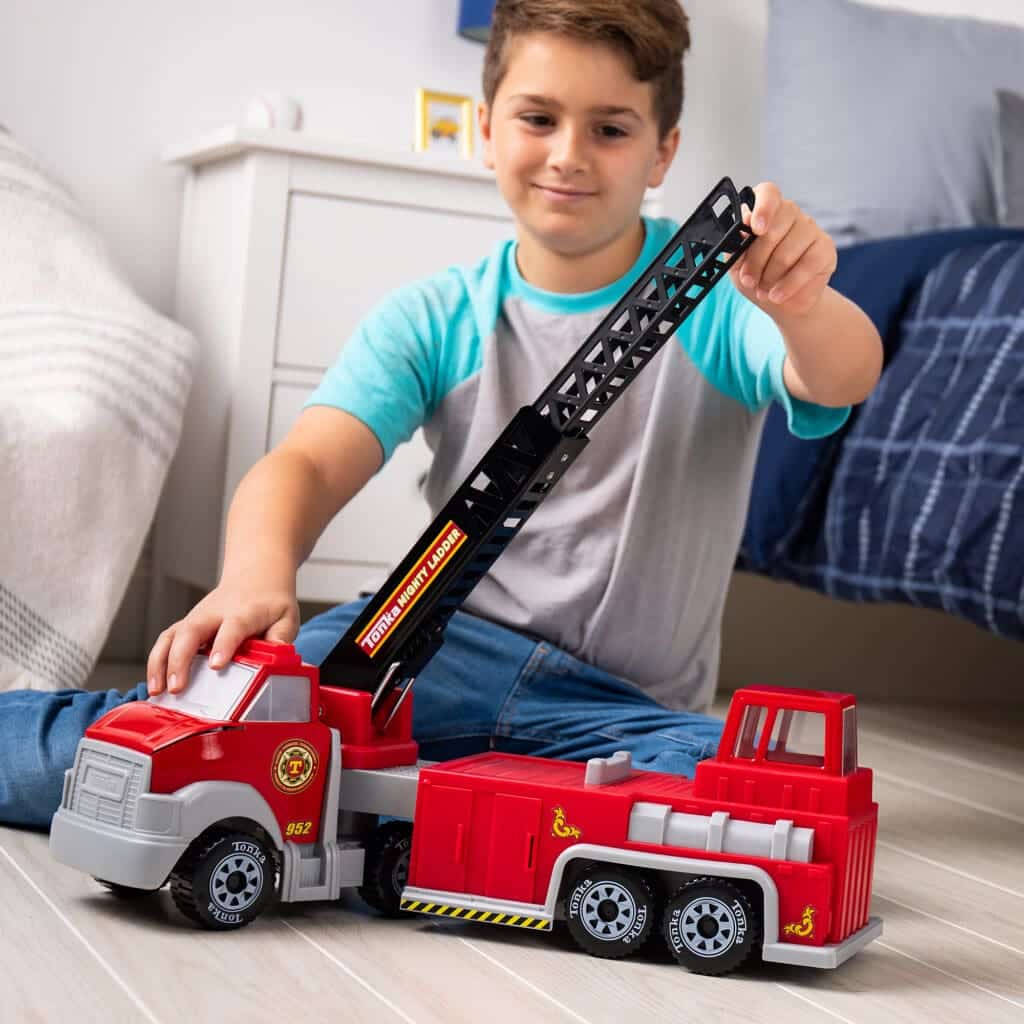 Tonka Hook N' Ladder Fire Truck being played with by young boy.