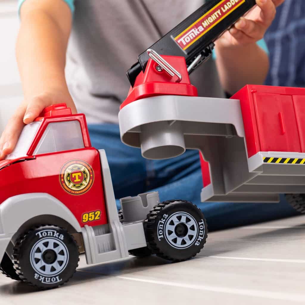 Tonka Hook N' Ladder Fire Truck being played with by young boy.