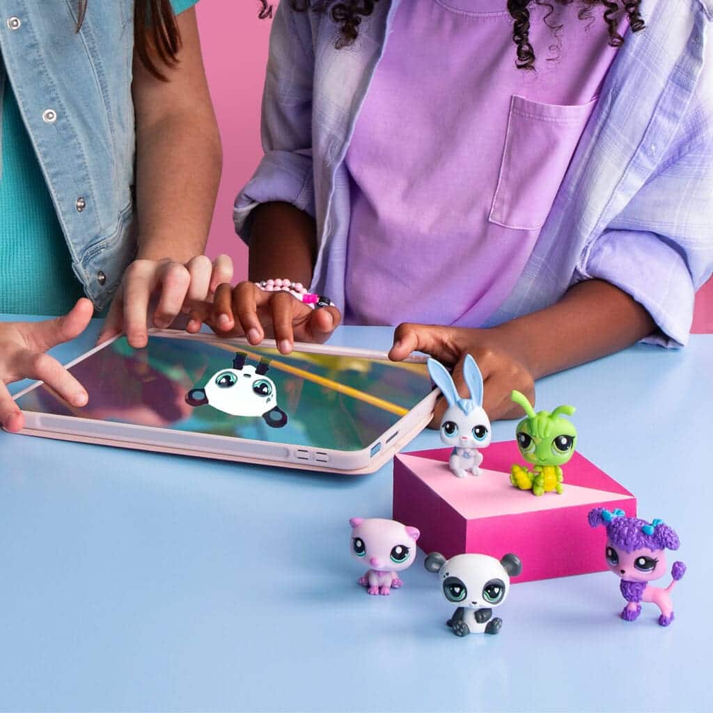 LPS Pet Surprise Singles being played with by young girls.