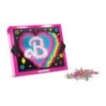 Lite Brite Barbie with colorful pegs on white background.