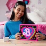 Lite Brite Super Brite HD Barbbie Edition being played with by young girl.