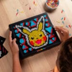 Lite Brite Super Bright HD Pokémon Edition being held by young boy.