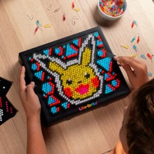 Lite Brite Super Bright HD Pokémon Edition being held by young boy.
