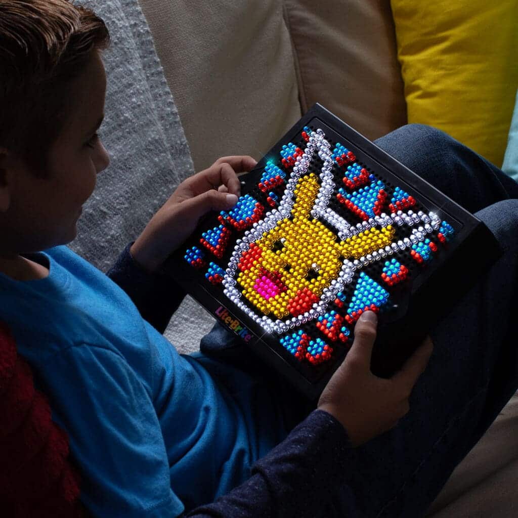 Lite Brite Super Bright HD Pokémon Edition being held by young boy.