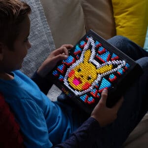 Lite Brite Super Bright HD Pokémon Edition being held by young boy.