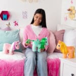 My Little Pony Trio being played with by young girl.