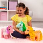 My Little Pony Trio being played with by young girl.