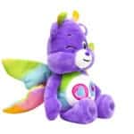 A purple Share Bear plush toy from the Care Bears collection is shown against a plain white background.