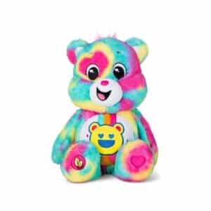 Care Bears Good Vibes Bear plush displayed on a white background, featuring bright colors and a cheerful expression, spreading positivity and good vibes.