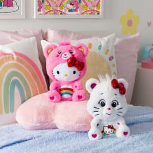 Care Bears Hello Kitty 2 Pack sitting on child's bed.
