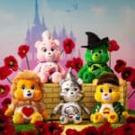 Photo of all five bears: Love-a-Lot Bear as Glinda, Good Luck Bear as Elphaba, Grumpy Bear as the Wicked Tin Man, Funshine Bear as the Scarecrow, Tenderheart Bear as the Lion