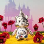 Close up front facing sitting photo of the Tin Man Care Bear