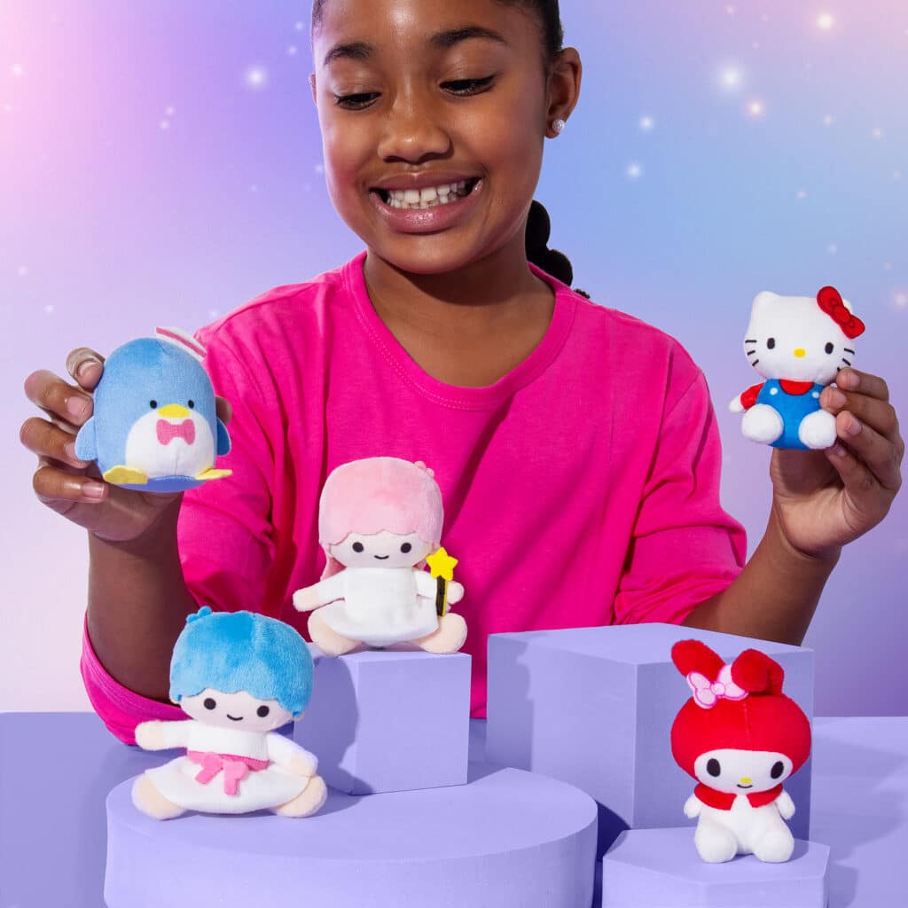 Little girl playing with all the Micro Teenies that come in the Micro Teenies Hello Kitty 5-Pack